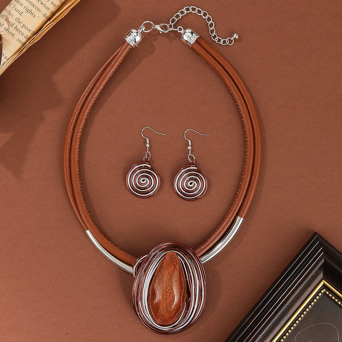 Jewelry set with brown necklace and earrings on a brown surface