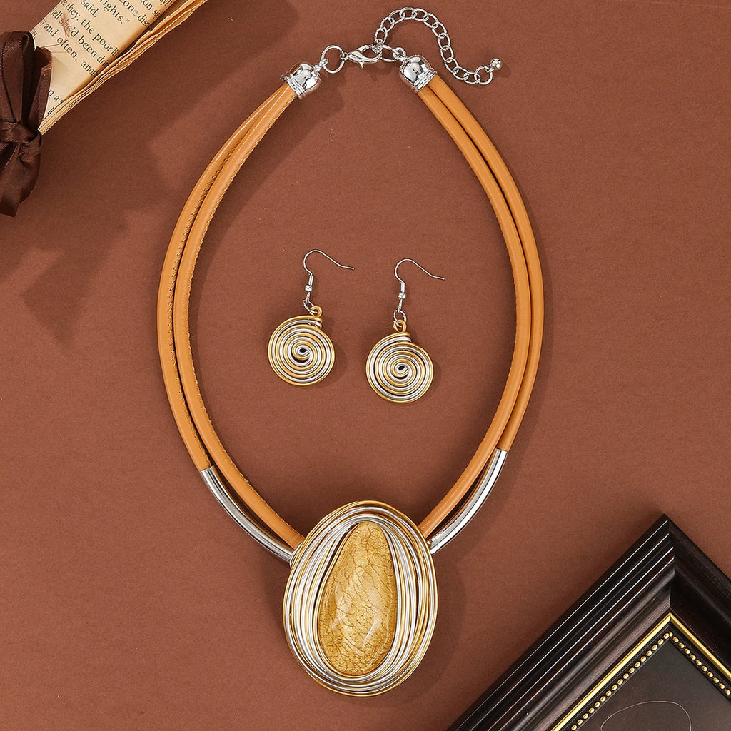 Jewelry set with necklace and earrings on a brown background