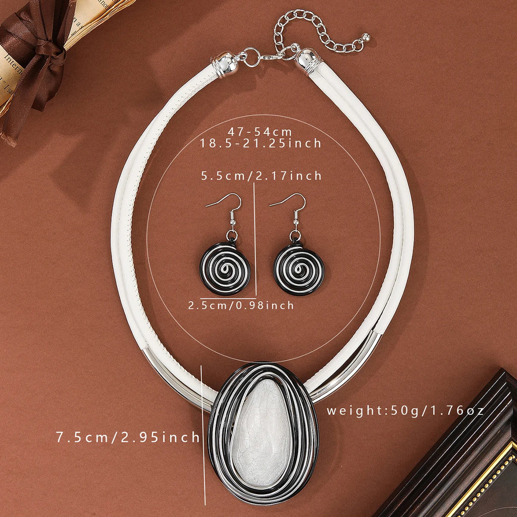 Jewelry set with necklace and earrings on a brown background