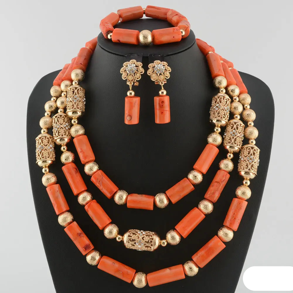 Jewelry set with coral beads and gold accents on a mannequin bust. Fashion Nigerian Coral Beads Set