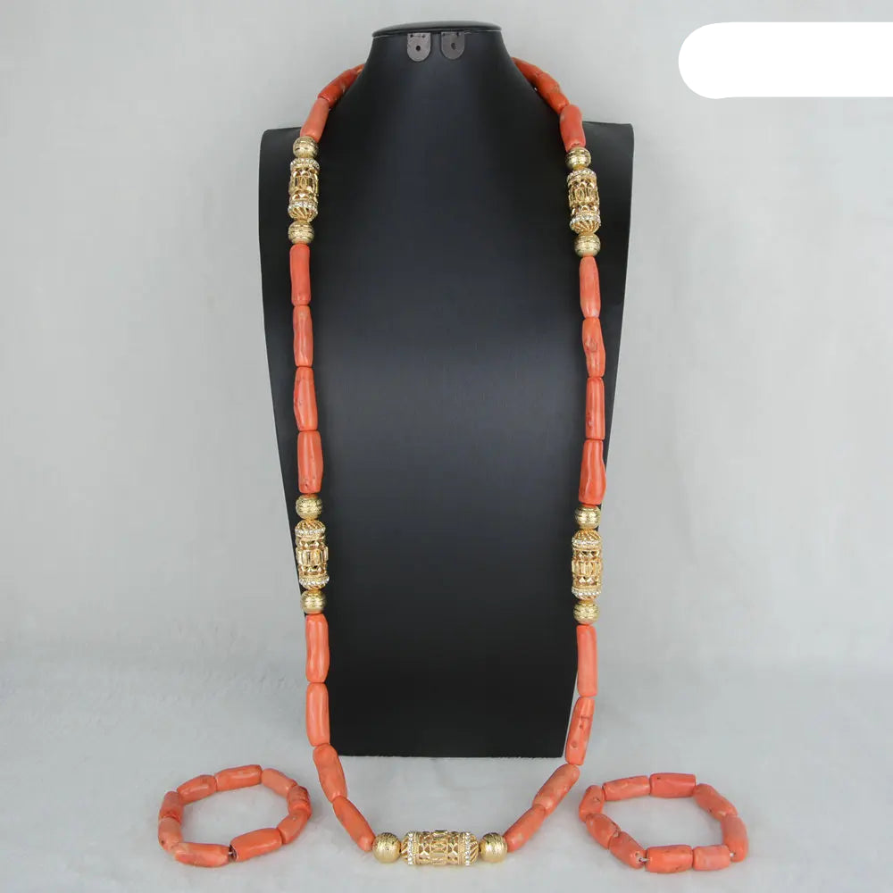 Coral beaded necklace with gold accents on a black mannequin against a gray background. Fashion Nigerian Coral Beads Set