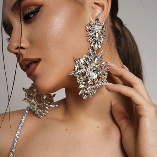 Model Using Geometric Rhinestone Dangle Earrings