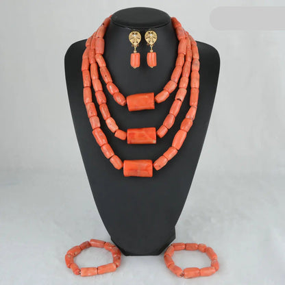 Coral-colored jewelry set on a black mannequin with 'C007-2' label.