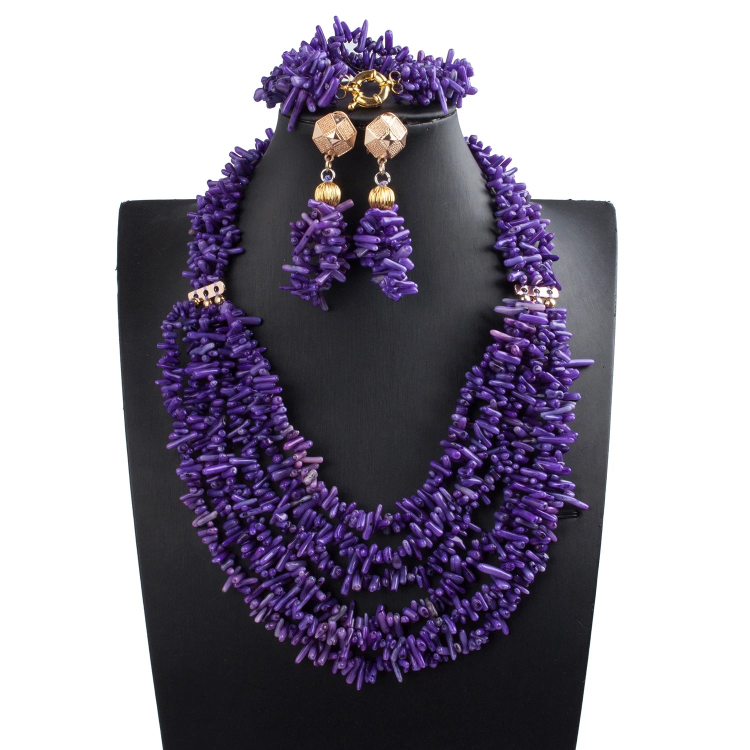 Purple beaded necklace and earrings set on a black mannequin bust.