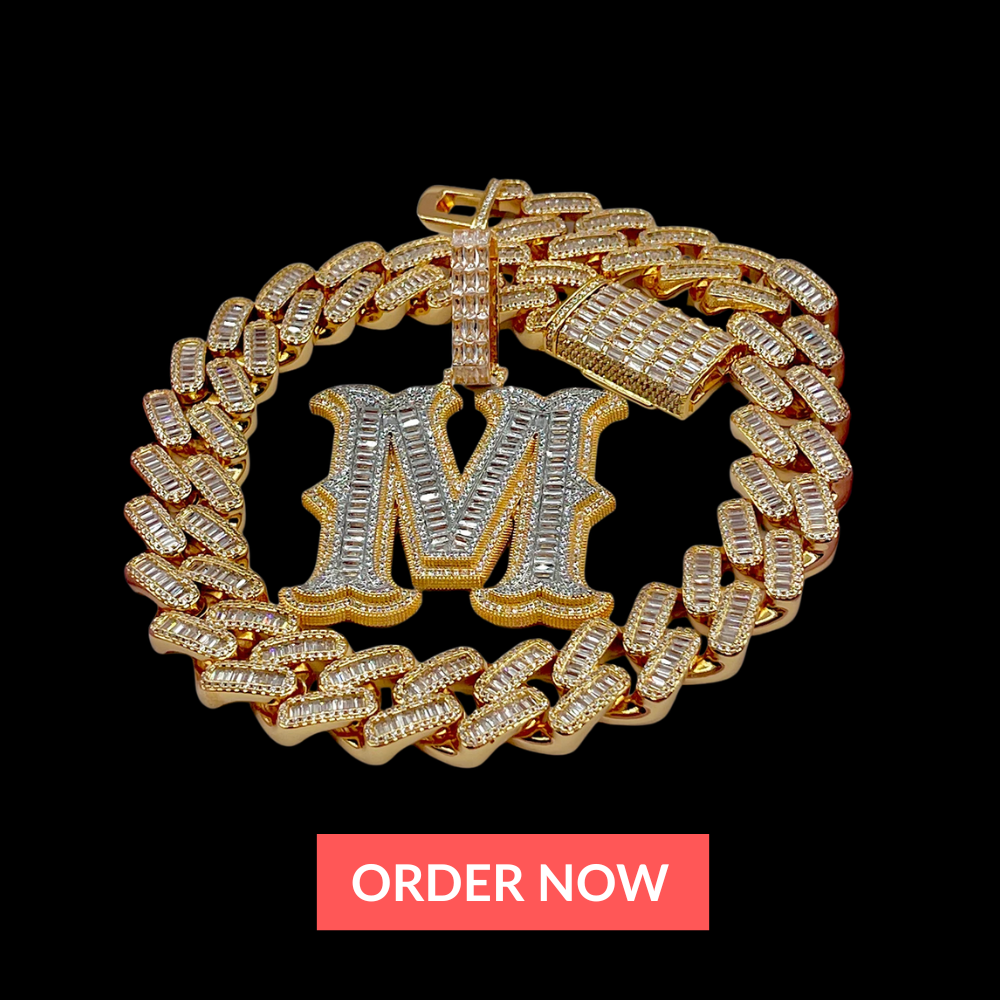 Gold chain bracelet with a silver 'M' pendant on a black background with 'ORDER NOW' button.