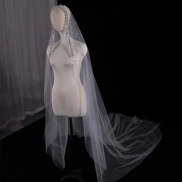 Vintage ivory bridal veil with pearls and rhinestones, elegant wedding headdress for bride.